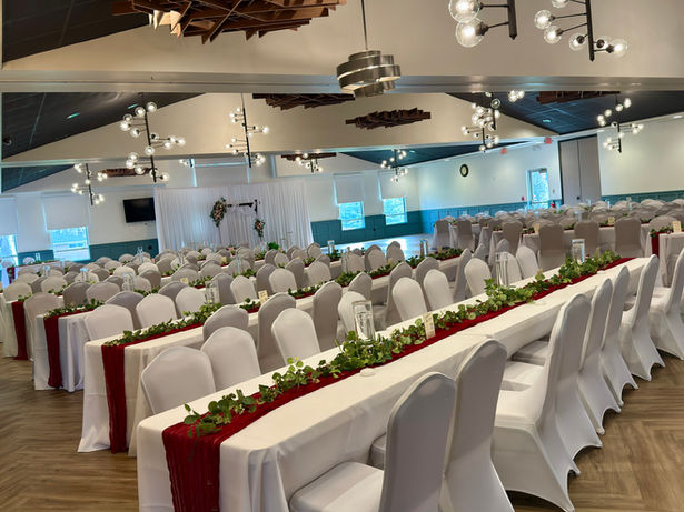 Vail Ballroom set for an event with white and red linens.