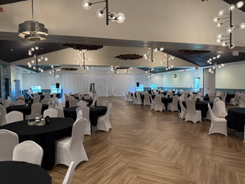 Modern Vail Ballroom with round tables and white chairs
