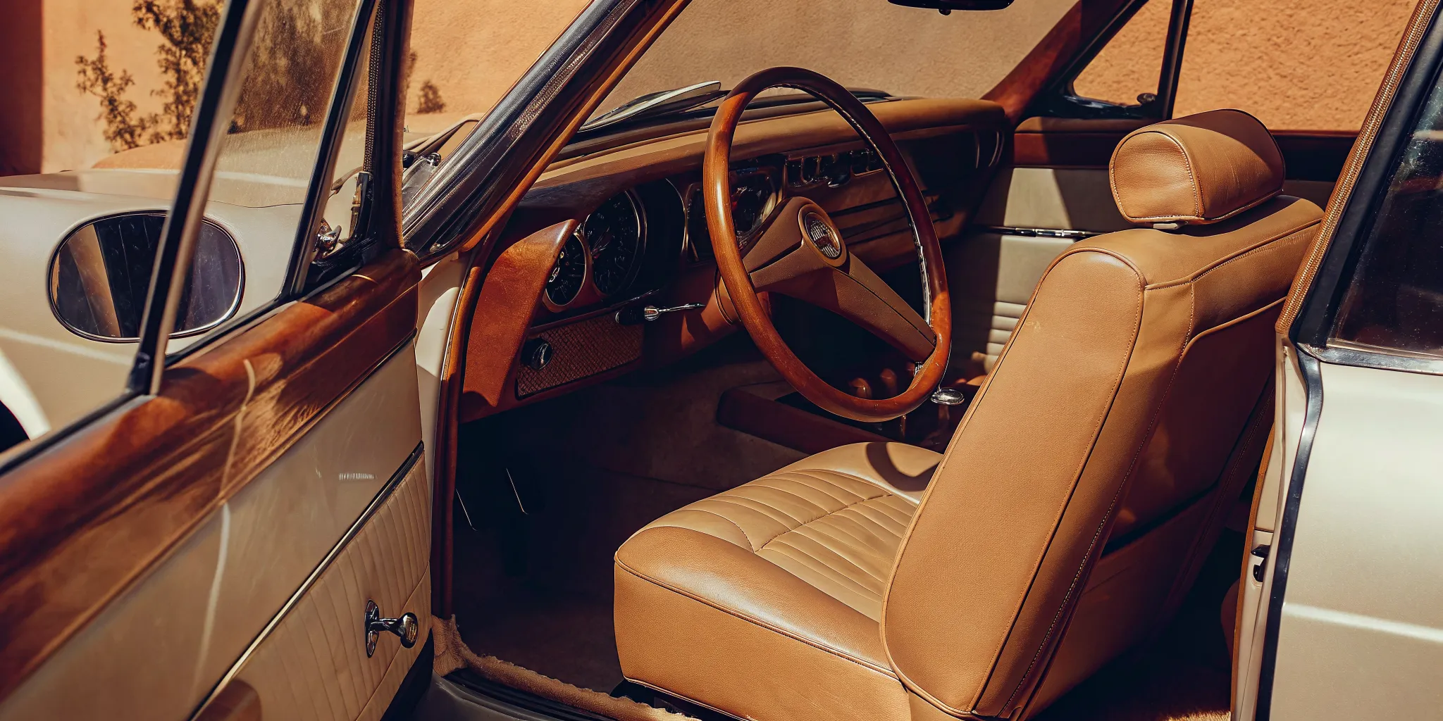 A clean car interior with sparkling leather seats and dashboard after detailing