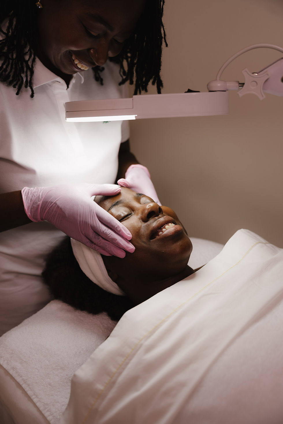 Aesthetician performing an LPD Signature Facial with G.M. Collin skincare products