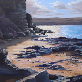 Evening sea sparkle and rocks