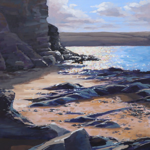 Evening sea sparkle and rocks
