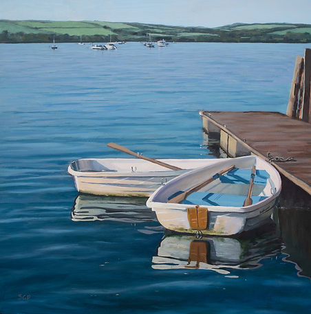 Two tenders rowing boats reflections in azure sea
