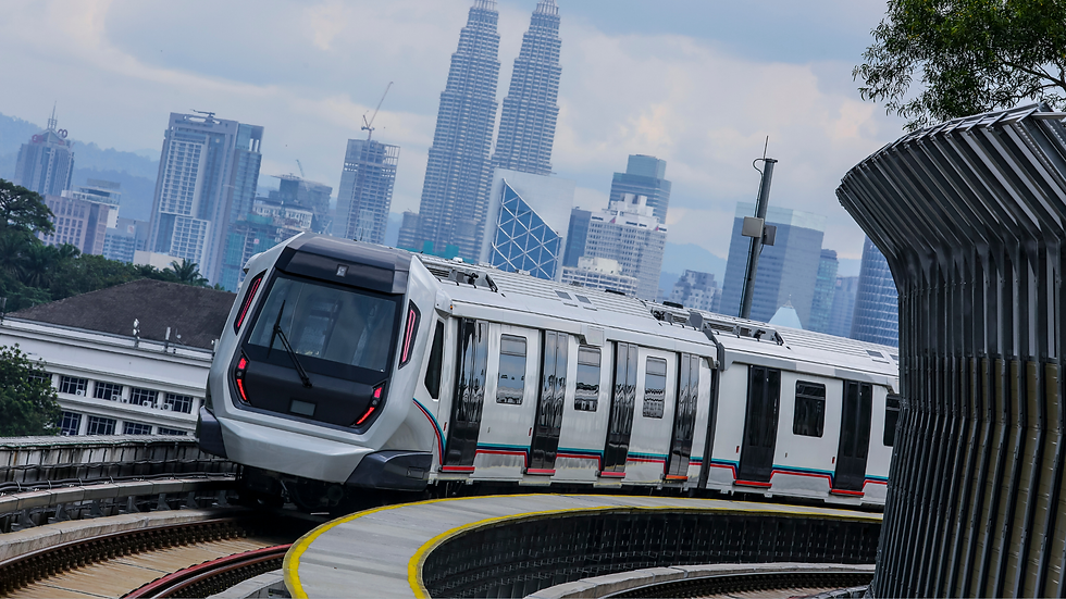 International students on a train in Kuala Lumpur with the Petronas Twin Towers in the background, symbolising Malaysia as a global study hub