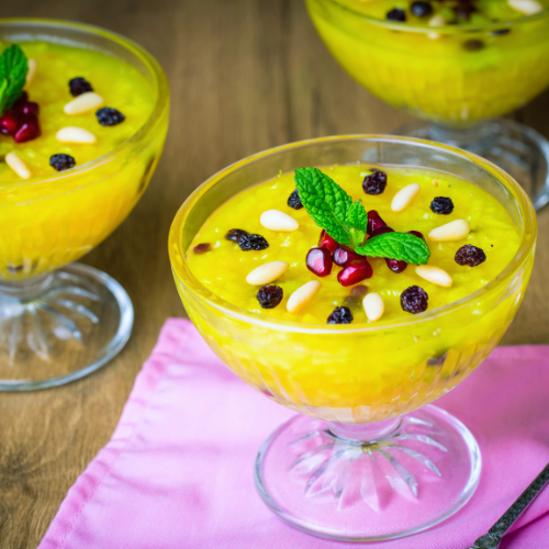 Close-up of zerde dessert topped with nuts