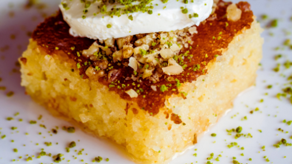 Close-up view of a slice of Revani on a plate
