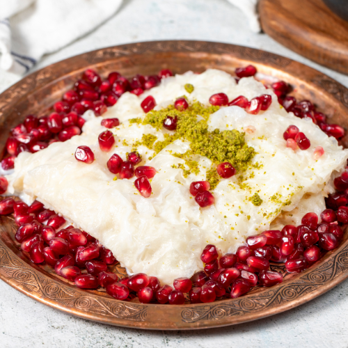 Eye-level view of a plate of Güllaç ready to be served