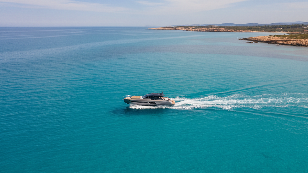 High angle view of a boat cruising on turquoise Mediterranean waters