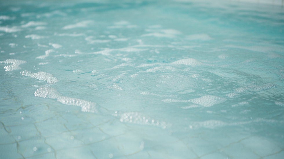 Close-up view of clean spa pool water with bubbles