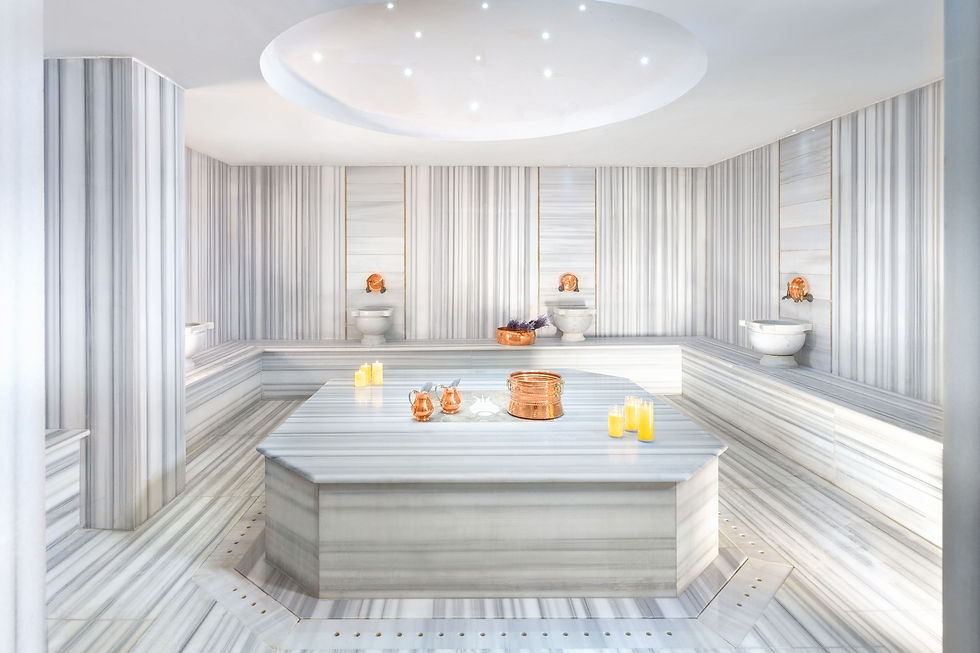 Eye-level view of a traditional Turkish hamam interior with marble and intricate tile work