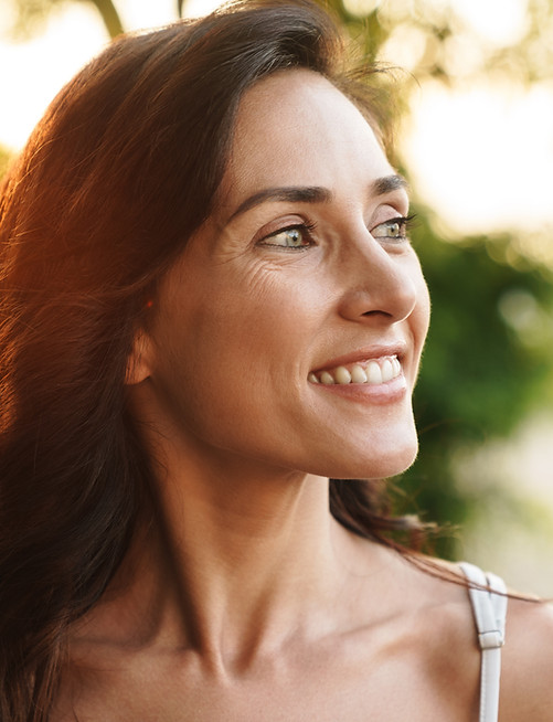 portrait-cute-brunette-woman-summer-dress-smiling-looking-aside-while-walking-outdoors.jpg