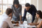 Office workers collaborating