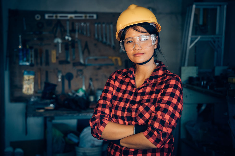 Female construction worker with hard hat and goggles
