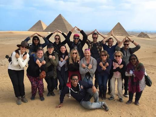 Group of travelers visiting the Pyramids of Giza in Egypt