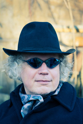 Male portrait color in a hat gentleman sunglasses