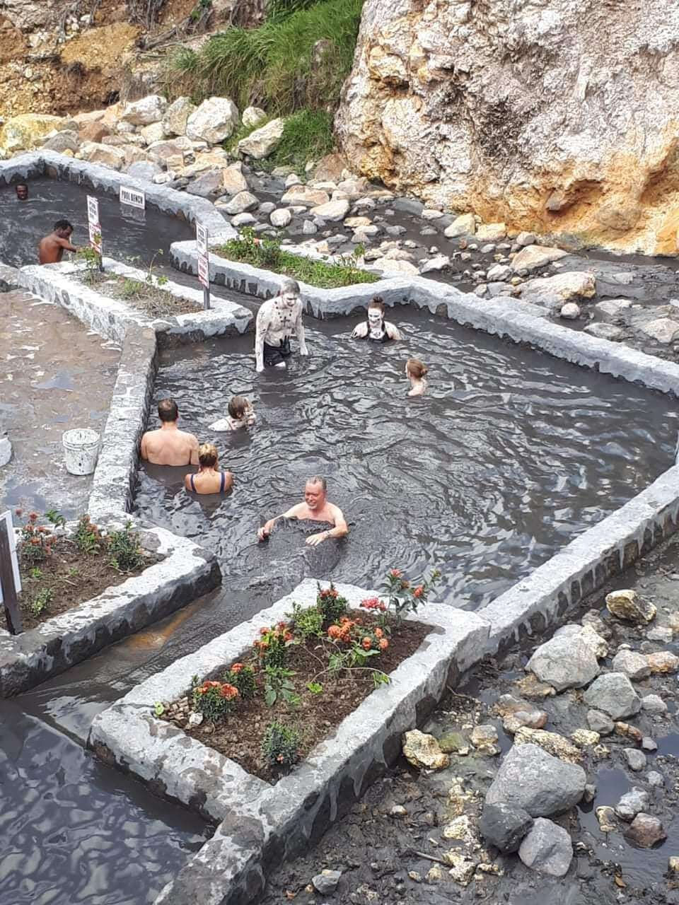 Happy client enjoying the St. Lucia Mud Bath