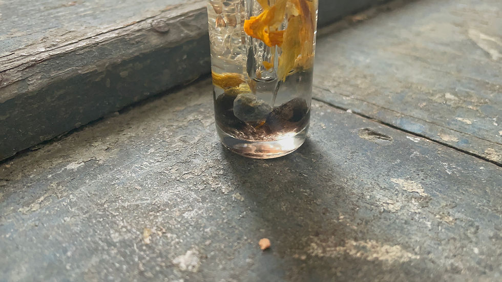 Thumbnail: ritual oil containing crystals, herbs and flowers for love and healing spells, and self-protection. Cottage witchcraft ritual