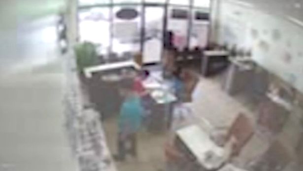 Security camera footage screenshot of TiJae at a nail salon