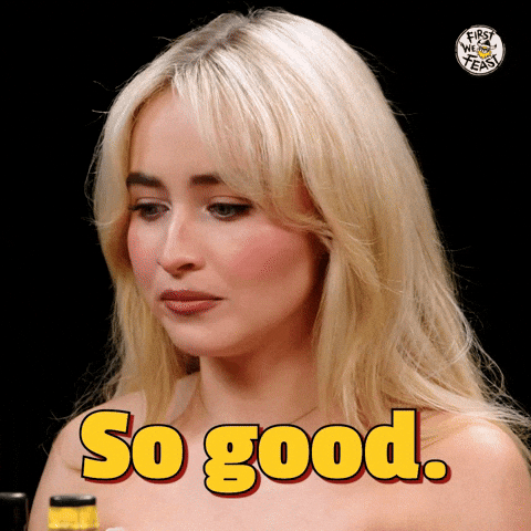 a moving image of a blonde woman chewing and saying "so good." the words "so good" are on the screen in bold yellow writing