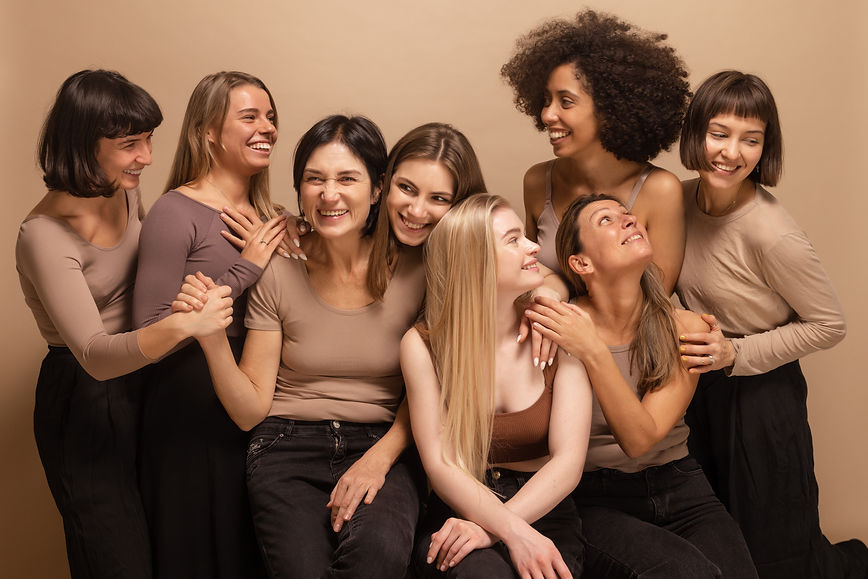 cute-interracial-young-adult-women-casual-clothes-chatting-among-themselves-beige-backgrou