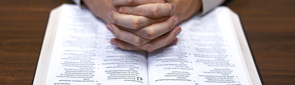 Man praying over his Bible_edited.jpg