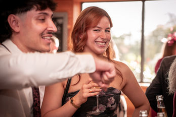 Wedding guests having fun wedding photography at the Out Barn in Clitheroe by Gemma Cullen