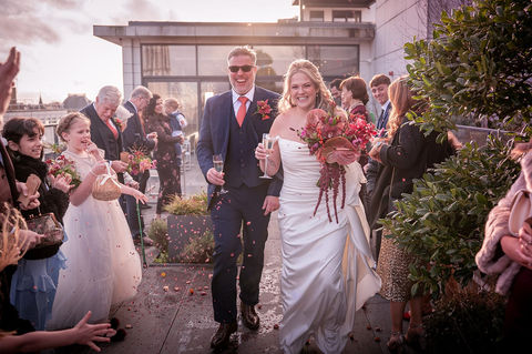 Bride and groom walking through confetti at Hope Street Hotel, Liverpool