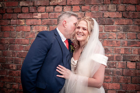 Groom making bride laugh at Hope Street Hotel, Liverpool