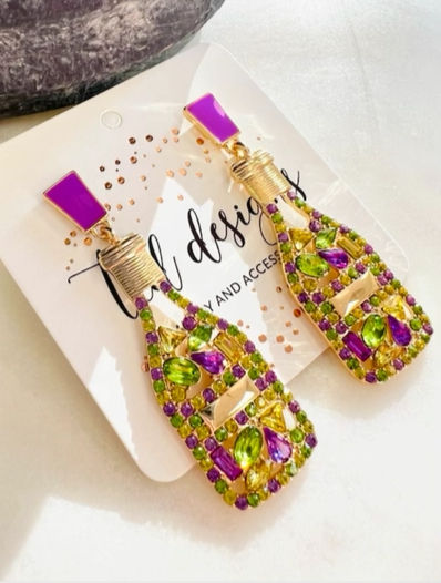 champagne bottles filled with mardi gras colored jewels