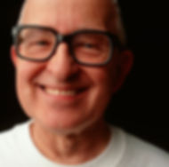 middle aged man with glasses smiling