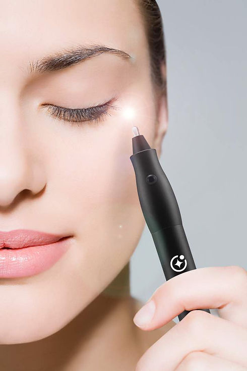 Close-up of a woman's face as she uses a black plasma pen, emitting a focused light onto her eyelid, highlighting the advanced skincare technology available at Derma Clear Advanced Skin & Laser Clinic