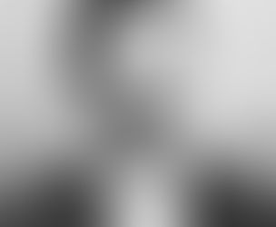 W.A. Waterman in a vintage suit with a bow tie and mustache posing against a neutral background.