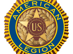American Legion emblem with a gold star, "US" in center, surrounded by laurel leaves. Blue and gold circular border with text "AMERICAN LEGION."