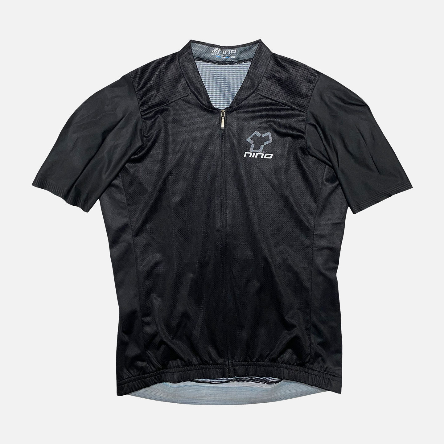 Black Alias Maillot Men shirt with a zipper and logo on white background