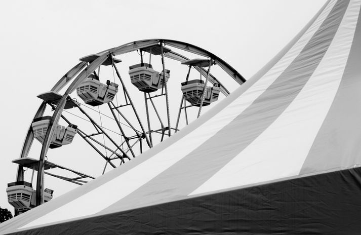 Black and white photograph of a ferris wheel over the bigtop by Little Rock artist Katie Adkins.