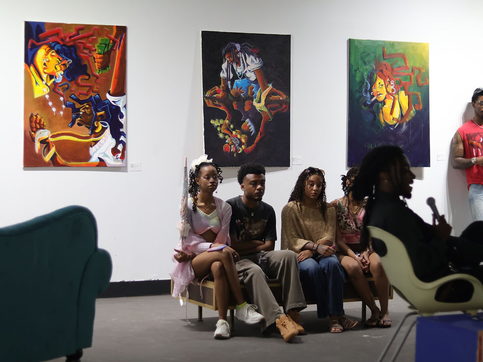 Exhibition visitor enjoy an artist talk with JBUCK at VIBE STUDIO JXN, photo by lougaFungi