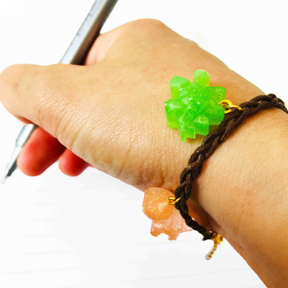 Thumbnail: Handmade cord bracelet and epoxy resin dinosaur charms