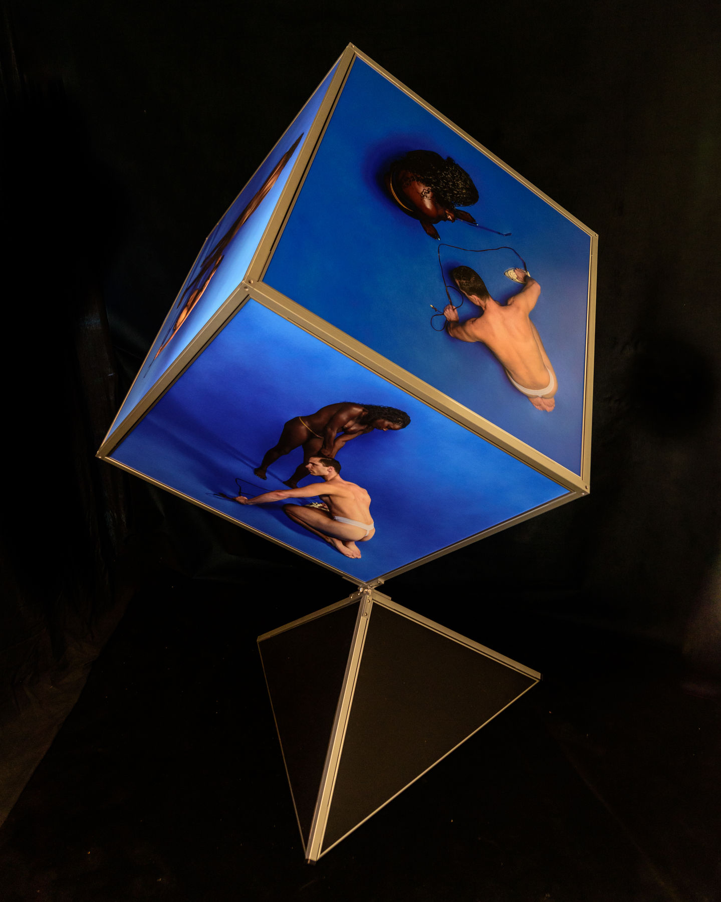 a cube with a picture of a man and a woman on it