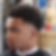 The tapered afro hair style after getting a fresh haircut. A trending hairstyle for young black men