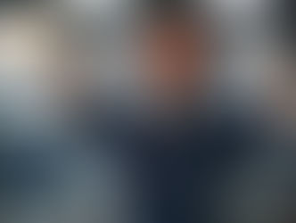 male construction worker flexing with smile