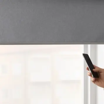 Electric blinds controlled by remote on a window