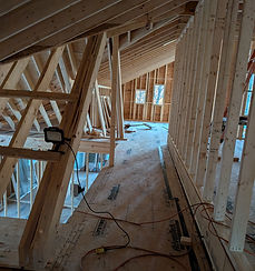 Cabin remodel in Jefferson County Georgia showing raised roof structure and new loft walkway framing