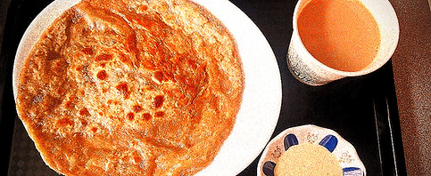 At Charsi Khyber Eats, our karak chai is brewed strong and spiced to perfection, served with hot, flaky parathas for the ulti