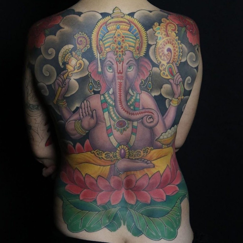Tattoo cost varies based in part on size. This Ganesh back piece by Mikey Vigilante is a multi-session piece.