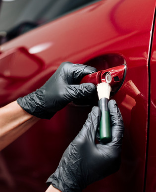 close-up-person-cleaning-car-exterior.jpg