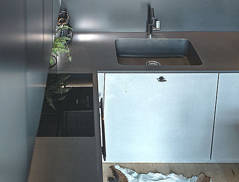 Concrete work surface, sink integrated into the surface