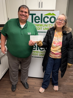 Maran and Brad Brevard, bank manager of TELCO, donating 10% of sales to Safelight.