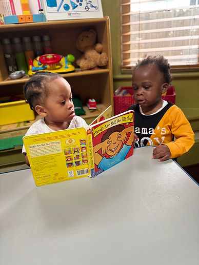 kids reading a book.jpeg