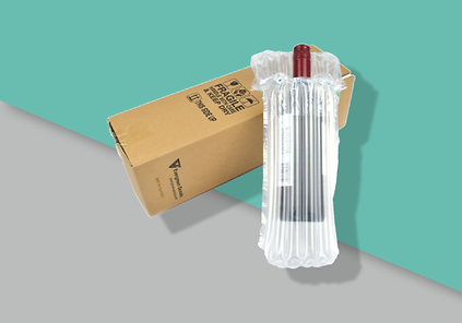 A bottle in an inflated protective packaging laying next to a compatible protective cardboard box