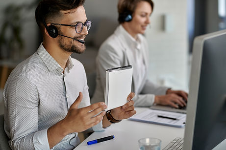 happy-customer-service-representative-using-computer-having-video-call-with-clients-while-